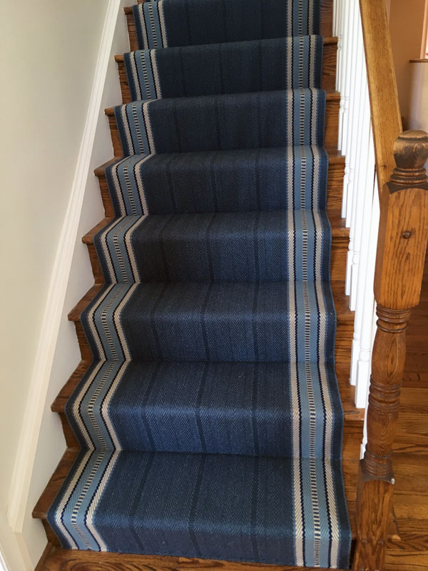 Wood stairs covered by Different Shades of Blue on a Straight Stair
